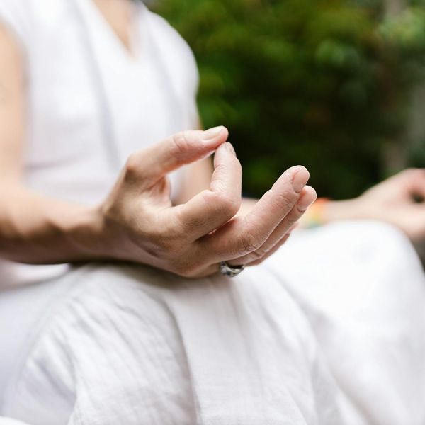 Hands folded in a mudra position close up