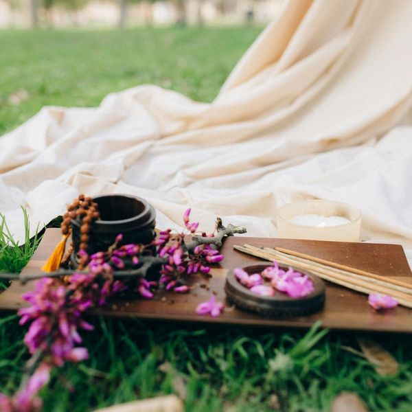 Zen garden elements like smooth stones and incense